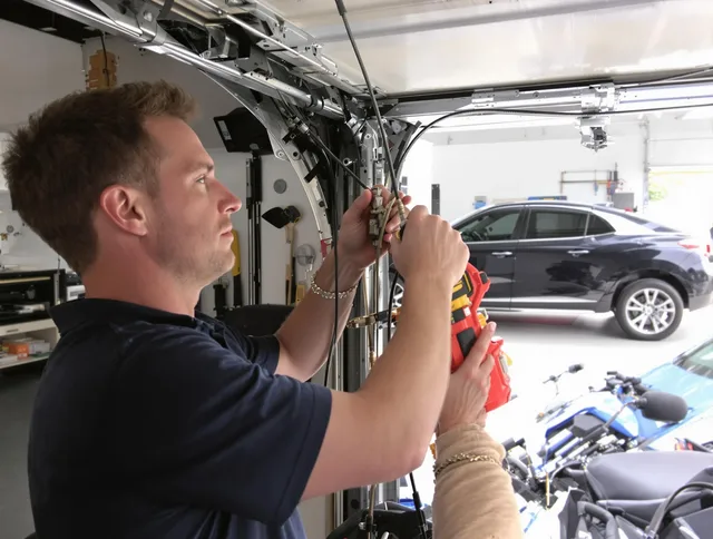 Port Wentworth Garage Door Repair safety certified technician performing cable replacement in Port Wentworth