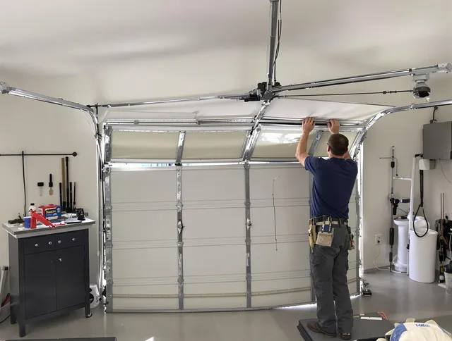 Port Wentworth Garage Door Repair specialist performing precise section replacement on Port Wentworth garage door